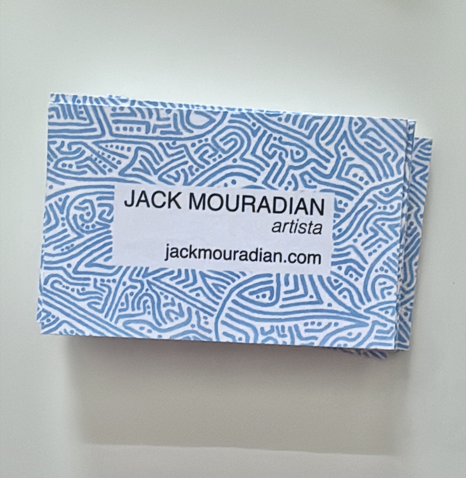 Business cards with Jack Mouradian's name over different sections of the blue linework from Untitled 1